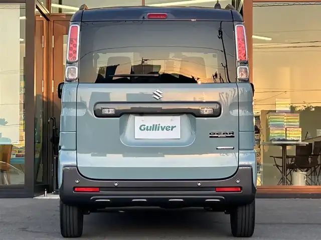 スズキ スペーシア ギア HYBRID XZターボ 愛媛県 2022(令4)年 2.5万km オフブルーメタリック/ガンメタリック2トーンルーフ ワンオーナー/純正ナビ（Bluetooth/フルセグTV）/両側パワースライドドア/ヘッドアップディスプレイ/バックカメラ/アダプティブクルーズコントロール/シートヒーター/純正フロアマット/純正14インチアルミホイール/パドルシフト/ステアリングリモコン/後席用テーブル/ルーフレール/リアセンサー/LEDヘッドライト/スマートキー