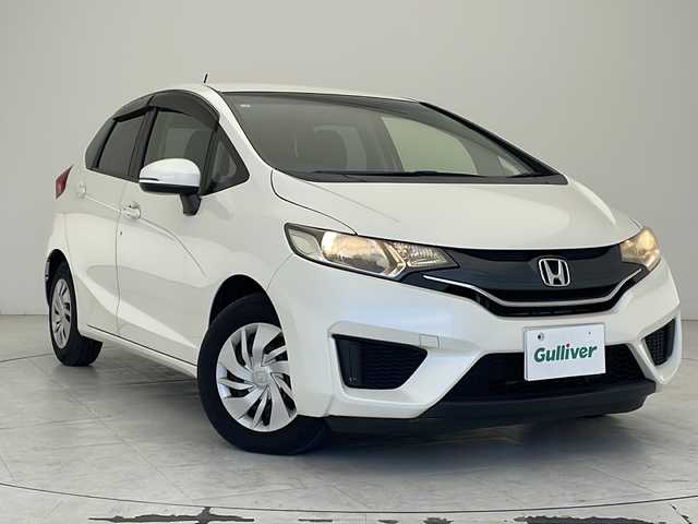 ホンダ フィット 13G Fパッケージ 沖縄県 2015(平27)年 7.4万km プレミアムホワイトパール 社外ナビ　【AVIC-RZ802】/　(ＴＶ　Ｂｌｕｅｔｏｏｔｈ　ＣＤ／ＤＶＤ)　/プッシュスタート　/スマートキー/スペアキー　/アイドリングストップ　/純正フロアマット　/ＥＴＣ　/横滑り防止機能　/パワーステアリング　/パワーウィンドウ　/ドアバイザー