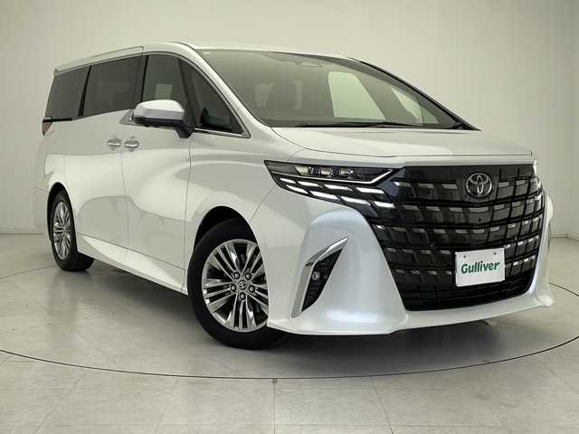 トヨタ アルファード Z 千葉県 2024(令6)年 0.6万km プラチナホワイトパールマイカ 14インチメーカーOPナビ/　フルセグTV/Bluetooth/Apple car play/Android Auto/純正フリップダウンモニター/ツインムーンルーフ/トヨタセーフティセンス/レーダークルーズコントロール/レーンキープアシスト/衝突軽減ブレーキ/クリアランスソナー/全方位カメラ/先行車発進警報/ロードサインアシスト/ヘッドアップディスプレイ/ブラインドスポットモニター/電動パーキング/オートホールド/オートハイビーム/両側パワースライド/デジタルインナーミラー/ワイヤレス充電/レザーシート/シートヒーター（セカンドシートまで）/エアーシート（セカンドシートまで）/パワーシート（セカンドシートまで）/メモリーシート（運）/ステアリングヒーター/パワーバックドア/LEDヘッドライト/フォグランプ/ビルトインETC2.0/フロアマット/ナノイーX/後席サンシェード