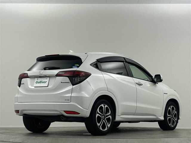 ホンダ ヴェゼル ハイブリッド Z ホンダセンシング 埼玉県 2020(令2)年 6.9万km プラチナホワイトパール 社外ナビ　衝突軽減　ＡＣＣ　バックカメラ　ＥＴＣ　ハーフレザー　前席シートヒーター　前後ドラレコ　パドルシフト　スマートキー　純正フロアマット　純正１７インチＡＷ　オートライト　ＣＤ　ＤＶＤ　ＢＴ