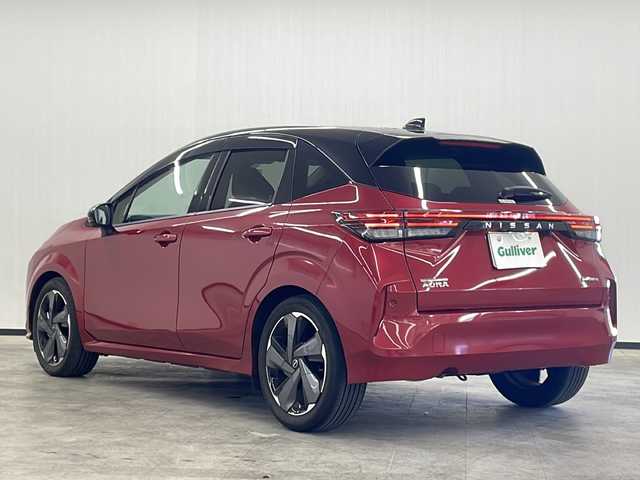 日産 オーラ G レザーエディション 長崎県 2022(令4)年 3.1万km ガーネットレッド/スーパーブラック 2トーン ワンオーナー/禁煙車/日産純正ナビ/（フルセグTV、DVD/Bluetooth）/ドライブレコーダー/ETC2.0/全方位バックカメラ/デジタルインナーミラー/オートライト/純正LEDヘッドランプ/衝突軽減システム/前後コーナーセンサー/17インチ純正AW/純正フロアマット/ステアリングスイッチ/プッシュスタート/スペアキー/取説、保証書