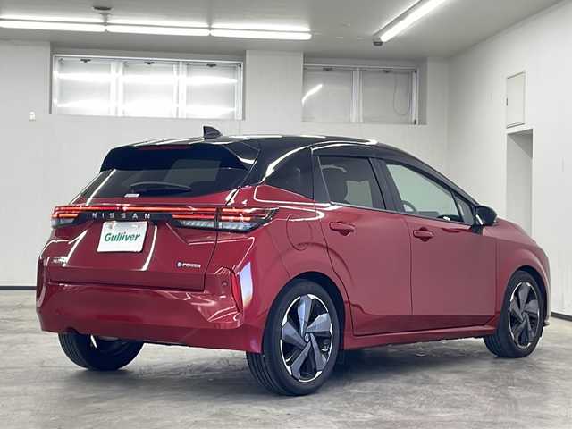 日産 オーラ G レザーエディション 長崎県 2022(令4)年 3.1万km ガーネットレッド/スーパーブラック 2トーン ワンオーナー/禁煙車/日産純正ナビ/（フルセグTV、DVD/Bluetooth）/ドライブレコーダー/ETC2.0/全方位バックカメラ/デジタルインナーミラー/オートライト/純正LEDヘッドランプ/衝突軽減システム/前後コーナーセンサー/17インチ純正AW/純正フロアマット/ステアリングスイッチ/プッシュスタート/スペアキー/取説、保証書