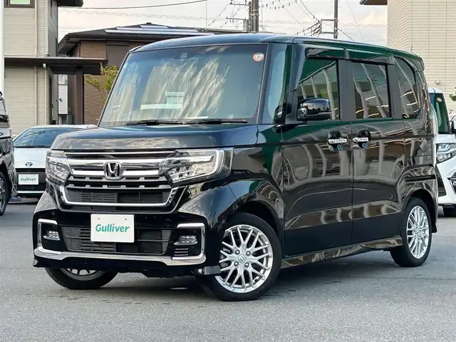 ホンダ Ｎ ＢＯＸ カスタム EX ターボ 静岡県 2022(令4)年 2.1万km クリスタルブラックパール 純正SDナビ（BT接続、CDチェンジャー、フルセグTV、DVD再生機能有り）/前後ドライブレコーダー/バックカメラ/両側パワースライドドア/純正アルミホイール/LEDヘッドライト/MTモード付き AT/クルーズコントロール（追従走行：有）/ETC/スマートキー（スペアキー１本）/エンジンスタートボタン/パワーステアリング/パワーウィンドウ/AAC/社外フロアマット/ABS/横滑り防止装置/レーンキープアシスト/コーナーセンサー/オートライト/オートマチックハイビーム/W+サイドエアバッグ