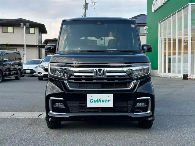 ホンダ Ｎ ＢＯＸ カスタム EX ターボ 静岡県 2022(令4)年 2.1万km クリスタルブラックパール 純正SDナビ（BT接続、CDチェンジャー、フルセグTV、DVD再生機能有り）/前後ドライブレコーダー/バックカメラ/両側パワースライドドア/純正アルミホイール/LEDヘッドライト/MTモード付き AT/クルーズコントロール（追従走行：有）/ETC/スマートキー（スペアキー１本）/エンジンスタートボタン/パワーステアリング/パワーウィンドウ/AAC/社外フロアマット/ABS/横滑り防止装置/レーンキープアシスト/コーナーセンサー/オートライト/オートマチックハイビーム/W+サイドエアバッグ