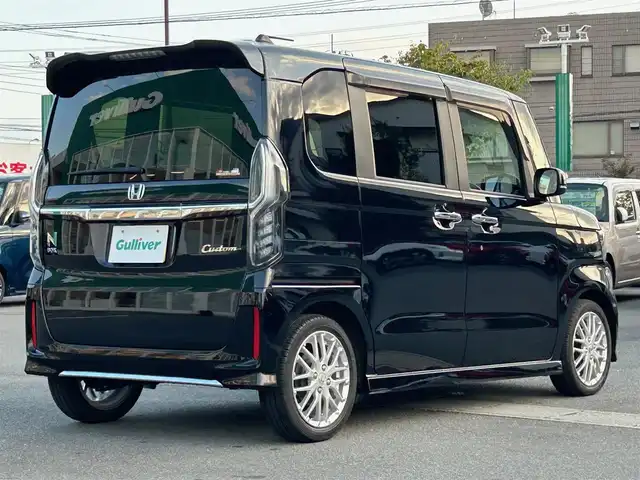 ホンダ Ｎ ＢＯＸ カスタム EX ターボ 静岡県 2022(令4)年 2.1万km クリスタルブラックパール 純正SDナビ（BT接続、CDチェンジャー、フルセグTV、DVD再生機能有り）/前後ドライブレコーダー/バックカメラ/両側パワースライドドア/純正アルミホイール/LEDヘッドライト/MTモード付き AT/クルーズコントロール（追従走行：有）/ETC/スマートキー（スペアキー１本）/エンジンスタートボタン/パワーステアリング/パワーウィンドウ/AAC/社外フロアマット/ABS/横滑り防止装置/レーンキープアシスト/コーナーセンサー/オートライト/オートマチックハイビーム/W+サイドエアバッグ