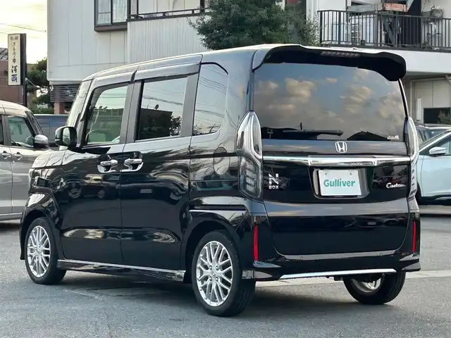 ホンダ Ｎ ＢＯＸ カスタム EX ターボ 静岡県 2022(令4)年 2.1万km クリスタルブラックパール 純正SDナビ（BT接続、CDチェンジャー、フルセグTV、DVD再生機能有り）/前後ドライブレコーダー/バックカメラ/両側パワースライドドア/純正アルミホイール/LEDヘッドライト/MTモード付き AT/クルーズコントロール（追従走行：有）/ETC/スマートキー（スペアキー１本）/エンジンスタートボタン/パワーステアリング/パワーウィンドウ/AAC/社外フロアマット/ABS/横滑り防止装置/レーンキープアシスト/コーナーセンサー/オートライト/オートマチックハイビーム/W+サイドエアバッグ