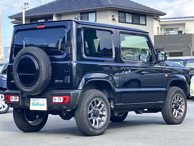 スズキ ジムニー XC 静岡県 2025(令7)年 1万km ブルーイッシュブラックパール3 エンジンスタートボタン/パワーステアリング/パワーウィンドウ/保証書/４ＷＤ/ターボ/アイドリングストップ/スマートキー/オートエアコン/クルーズコントロール/布シート/前席シートヒーター/背面タイヤ/純正アルミホイール/ＡＢＳ/横滑り防止装置/コーナーセンサー/センターデフロック/レーンキープアシスト/オートライト/オートマチックハイビーム/ダウンヒルアシストコントロール/Ｗ+サイドエアバッグ/衝突軽減システム