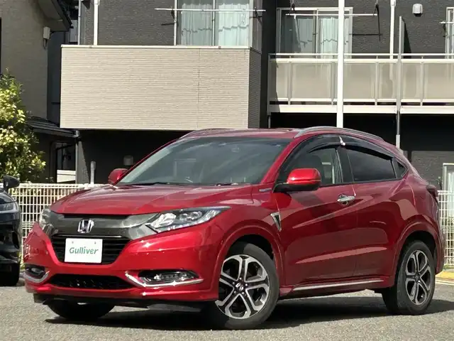 ホンダ ヴェゼル ハイブリッド 宮城県 2016(平28)年 9.7万km プレミアムクリスタルレッドM 純正ＳＤナビ（フルセグＴＶ、ＣＤ、ＤＶＤ、ＡＭ、ＦＭ、ＢＴ）//ドラレコ//純正ＡＷ//追従クルコン//純正フロアマット//ビルトインＥＴＣ//ＵＳＢポート//前席シートヒーター//バックカメラ//ワイパーデアイサー//電動格納ドアミラー//車線逸脱アラート//横滑り防止機能//プリクラッシュセーフティ
