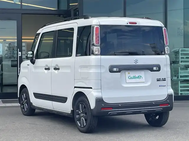 スズキ スペーシア ギア HYBRID XZ 東京都 2023(令5)年 0.3万km ピュアホワイトP スズキセーフティサポート/・デュアルカメラブレーキサポート/・車線逸脱警報機能/・先行車発進お知らせ機能/・誤発進抑制機能/・アダプティブクルーズコントロール/・コーナーセンサー/・ヘッドアップディスプレイ/プッシュスタート/アイドリングストップ/社外10型ディスプレイオーディオ/両側パワースライドドア/シートヒーター/パーソナルテーブル/スリムサーキュレーター/LEDヘッドライト/ルーフレール/14インチ純正アルミホイール/スマートキー