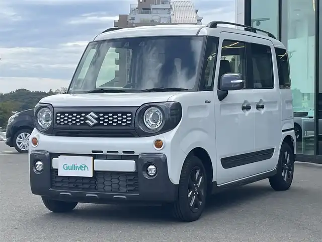 スズキ スペーシア ギア HYBRID XZ 東京都 2023(令5)年 0.3万km ピュアホワイトP スズキセーフティサポート/・デュアルカメラブレーキサポート/・車線逸脱警報機能/・先行車発進お知らせ機能/・誤発進抑制機能/・アダプティブクルーズコントロール/・コーナーセンサー/・ヘッドアップディスプレイ/プッシュスタート/アイドリングストップ/社外10型ディスプレイオーディオ/両側パワースライドドア/シートヒーター/パーソナルテーブル/スリムサーキュレーター/LEDヘッドライト/ルーフレール/14インチ純正アルミホイール/スマートキー