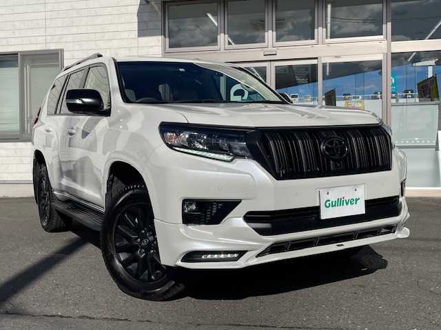 トヨタ ランドクルーザー プラド TX Lパッケージ マットブラED 青森県 2022(令4)年 1.5万km ホワイトパールクリスタルシャイン ワンオーナー/TRDエアロパーツ（フロント、リア）/エンジンスターター/スペアキー/チルト＆スライド電動ムーンルーフ/寒冷地仕様/ルーフレール/ベージュ本革シート/ETC/ドライブレコーダー/ディスプレイオーディオ/マルチテレインモニター（フロント、サイド、バック）/メーカーナビ（Apple car play/Android Auto/AM/FM/Bluetooth/TV)/フロントフォグランプ/リアフォグランプ/シートヒーター(D/N)/取扱説明書/ナビ取扱説明書/保証書