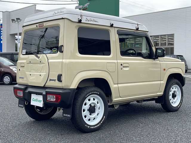 スズキ ジムニー XC 東京都 2023(令5)年 1.1万km シフォンアイボリーM ルーフテントキャノティエＪ３/デュアルセンサーブレーキサポート/ディスプレイオーディオ/バックカメラ/ETC/プッシュスタート/クルーズコントロール/保証書/取説書/スペアキスマートキー