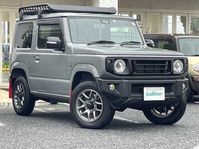 スズキ ジムニー XC 千葉県 2023(令5)年 0.6万km ミディアムグレー 8型ナビCN-RZ875　バックカメラ　革調カバー　シートヒーター　ドラレコ　クルコン　コンビハンドル　ルーフラック　リアラダー　LEDライト　オートライト　外グリル　セーフティサポート　ラバーマット