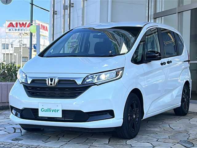 ホンダ フリード G ブラックスタイル 静岡県 2022(令4)年 1.4万km パール 純正ナビ（FM AM DVD SD フルセグTV Bluetooth）/バックカメラ/3列シート/両側パワースライドドア/アダプティブクルーズコントロール/シートヒーターD＋N席/チップアップシート/ETC/USB入力端子/ステアリングリモコン/ホンダセンシング/純正フロアマット/純正ナビアルミホイール/LEDヘッドライト/寒冷地仕様