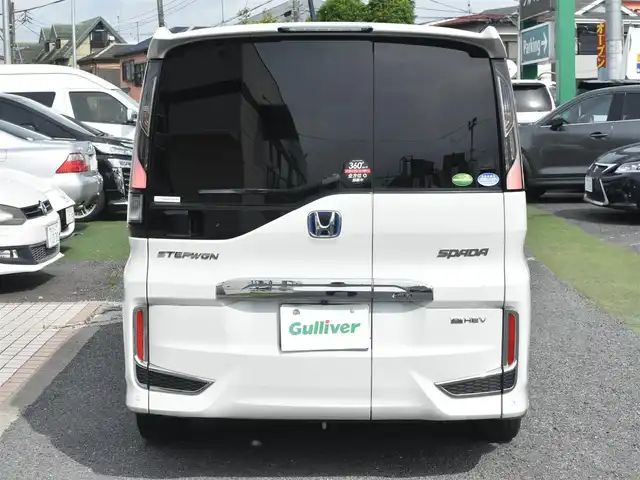 ホンダ ステップワゴン スパーダ eHEV G EXホンダS 神奈川県 2021(令3)年 7.5万km プラチナホワイトパール ナビ装着用スペシャルパッケージ＋ETC2.0車載器(ナビ連動)/マルチビューカメラシステム/Honda SENSING/1列目シート用i-サイドエアバッグシステム＋サイドカーテンエアバッグシステム(1-3列目シート対応)/わくわくゲート/トリプルゾーンコントロール・フルオートエアコンディショナー/16インチアルミホイール/専用インテリア/本革シート/運転席＆助手席シートヒーター/AC電源1500W/パフォーマンスダンパー純正メモリナビ/フルセグテレビ/全方位カメラ/後席モニター/両側パワースライドドア/スマートミラー/ETC2.0/LEDヘッドライト/ドライブレコーダー前後/取説/ナビ説/記録(R.4.5.6)/スペアスマートキー