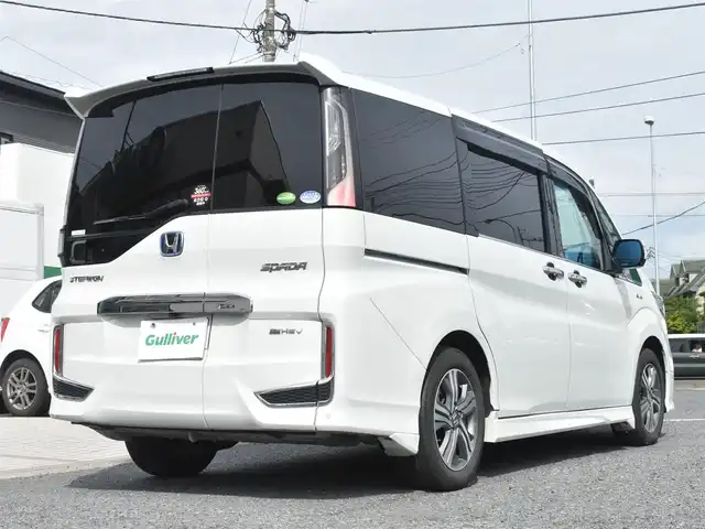 ホンダ ステップワゴン スパーダ eHEV G EXホンダS 神奈川県 2021(令3)年 7.5万km プラチナホワイトパール ナビ装着用スペシャルパッケージ＋ETC2.0車載器(ナビ連動)/マルチビューカメラシステム/Honda SENSING/1列目シート用i-サイドエアバッグシステム＋サイドカーテンエアバッグシステム(1-3列目シート対応)/わくわくゲート/トリプルゾーンコントロール・フルオートエアコンディショナー/16インチアルミホイール/専用インテリア/本革シート/運転席＆助手席シートヒーター/AC電源1500W/パフォーマンスダンパー純正メモリナビ/フルセグテレビ/全方位カメラ/後席モニター/両側パワースライドドア/スマートミラー/ETC2.0/LEDヘッドライト/ドライブレコーダー前後/取説/ナビ説/記録(R.4.5.6)/スペアスマートキー