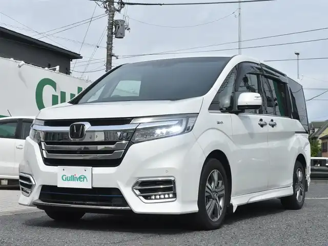 ホンダ ステップワゴン スパーダ eHEV G EXホンダS 神奈川県 2021(令3)年 7.5万km プラチナホワイトパール ナビ装着用スペシャルパッケージ＋ETC2.0車載器(ナビ連動)/マルチビューカメラシステム/Honda SENSING/1列目シート用i-サイドエアバッグシステム＋サイドカーテンエアバッグシステム(1-3列目シート対応)/わくわくゲート/トリプルゾーンコントロール・フルオートエアコンディショナー/16インチアルミホイール/専用インテリア/本革シート/運転席＆助手席シートヒーター/AC電源1500W/パフォーマンスダンパー純正メモリナビ/フルセグテレビ/全方位カメラ/後席モニター/両側パワースライドドア/スマートミラー/ETC2.0/LEDヘッドライト/ドライブレコーダー前後/取説/ナビ説/記録(R.4.5.6)/スペアスマートキー