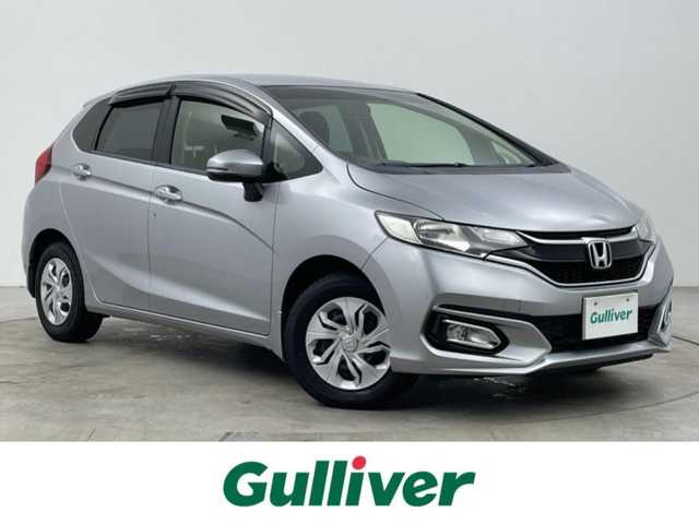 ホンダ フィット 13G F 大分県 2017(平29)年 2.7万km ルナシルバーM 社外７型ナビ　CN-RE03D/(CD/DVD/BT/SD/フルセグ)/バックカメラ/ＥＴＣ/レーダー探知機　YA-W17GA)/プッシュスタート/電動格納ウィンカーミラー/フォグランプ/ステアリングリモコン/ドアバイザー/純正フロアマット/スマートキー×２/取扱説明書/保証書・点検記録簿