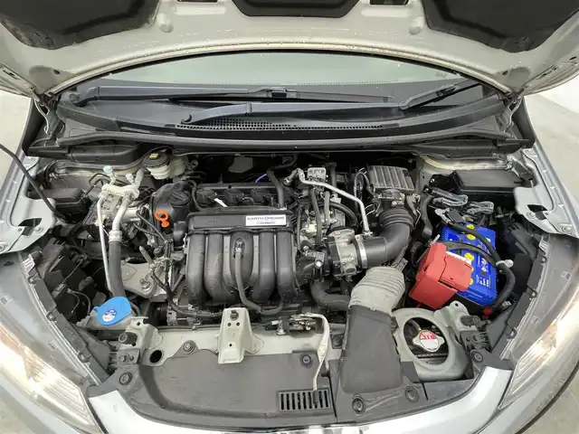 ホンダ フィット 13G F 大分県 2017(平29)年 2.7万km ルナシルバーM 社外７型ナビ　CN-RE03D/(CD/DVD/BT/SD/フルセグ)/バックカメラ/ＥＴＣ/レーダー探知機　YA-W17GA)/プッシュスタート/電動格納ウィンカーミラー/フォグランプ/ステアリングリモコン/ドアバイザー/純正フロアマット/スマートキー×２/取扱説明書/保証書・点検記録簿