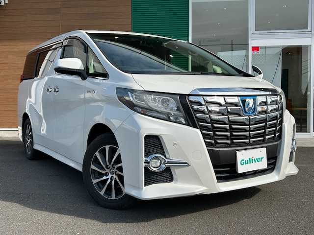 トヨタ アルファードハイブリット SR 静岡県 2017(平29)年 9.9万km ホワイトパールクリスタルシャイン ワンオーナー/純正メモリナビ/AM/FM/CD/DVD/BT/フルセグ/バックカメラ/フリップダウンモニター/両側パワースライドドア/純正フロアマット/クルーズコントロール/オートホールド/パワーバックドア/ビルトイン2.0ETC/ハーフレザーシート/オットマン（助手席・セカンドシート）