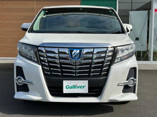 トヨタ アルファードハイブリット SR 静岡県 2017(平29)年 9.9万km ホワイトパールクリスタルシャイン ワンオーナー/純正メモリナビ/AM/FM/CD/DVD/BT/フルセグ/バックカメラ/フリップダウンモニター/両側パワースライドドア/純正フロアマット/クルーズコントロール/オートホールド/パワーバックドア/ビルトイン2.0ETC/ハーフレザーシート/オットマン（助手席・セカンドシート）