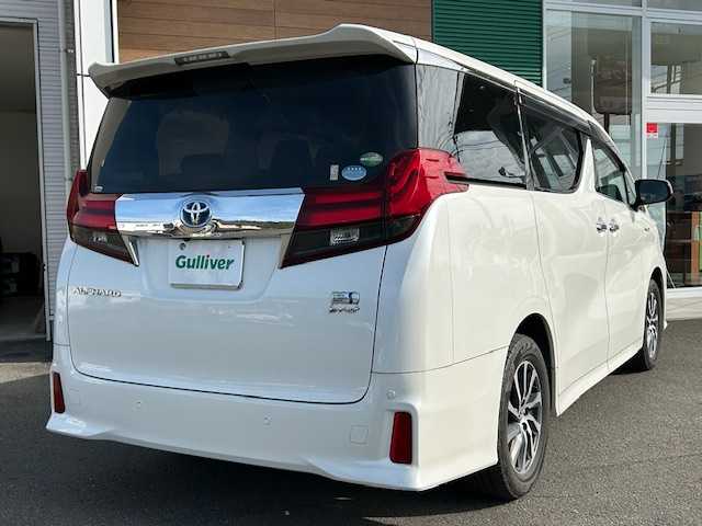 トヨタ アルファードハイブリット SR 静岡県 2017(平29)年 9.9万km ホワイトパールクリスタルシャイン ワンオーナー/純正メモリナビ/AM/FM/CD/DVD/BT/フルセグ/バックカメラ/フリップダウンモニター/両側パワースライドドア/純正フロアマット/クルーズコントロール/オートホールド/パワーバックドア/ビルトイン2.0ETC/ハーフレザーシート/オットマン（助手席・セカンドシート）