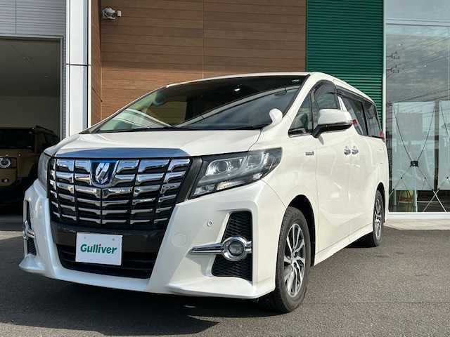 トヨタ アルファードハイブリット SR 静岡県 2017(平29)年 9.9万km ホワイトパールクリスタルシャイン ワンオーナー/純正メモリナビ/AM/FM/CD/DVD/BT/フルセグ/バックカメラ/フリップダウンモニター/両側パワースライドドア/純正フロアマット/クルーズコントロール/オートホールド/パワーバックドア/ビルトイン2.0ETC/ハーフレザーシート/オットマン（助手席・セカンドシート）