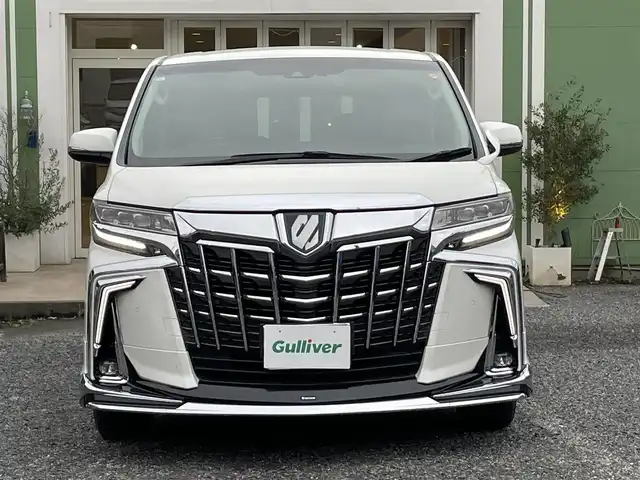 トヨタ アルファードハイブリット SR Cパッケージ 埼玉県 2021(令3)年 2.2万km ホワイトパールクリスタルシャイン モデリスタエアロ/検査時21.339km/純正9型ナビTV/純正フリップダウンモニター/バックカメラ/デジタルインナーミラー/前方ドライブレコーダー/レザーシート/1.2列目パワーシート/エアシート＆シートヒーター/ハンドルヒーター/助手席、２列目　オットマン/パワーバックドア/両側パワースライドドア/セーフティセンス/レーダークルーズコントロール/LEDヘッドライト/ETC 2.0/AC100V　１５００Wｘ２/プッシュスタート/保証書付整備手帳/取扱説明書