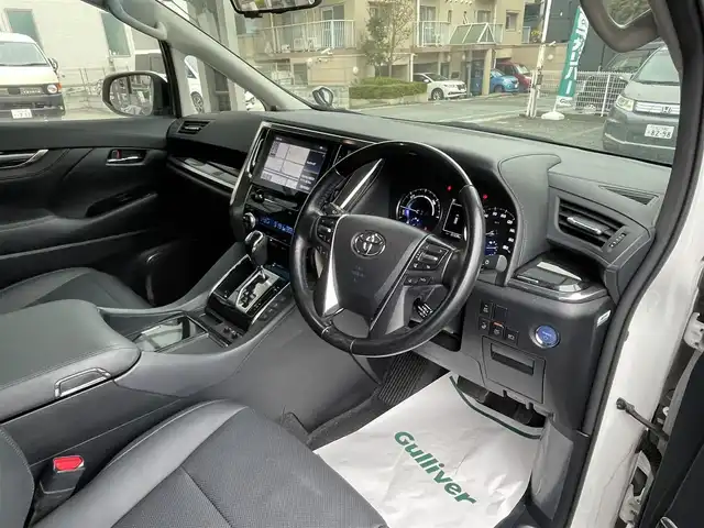 トヨタ アルファードハイブリット SR Cパッケージ 埼玉県 2021(令3)年 2.2万km ホワイトパールクリスタルシャイン モデリスタエアロ/検査時21.339km/純正9型ナビTV/純正フリップダウンモニター/バックカメラ/デジタルインナーミラー/前方ドライブレコーダー/レザーシート/1.2列目パワーシート/エアシート＆シートヒーター/ハンドルヒーター/助手席、２列目　オットマン/パワーバックドア/両側パワースライドドア/セーフティセンス/レーダークルーズコントロール/LEDヘッドライト/ETC 2.0/AC100V　１５００Wｘ２/プッシュスタート/保証書付整備手帳/取扱説明書