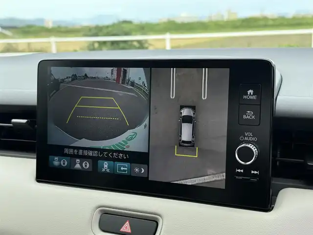 ホンダ ヴェゼル ハイブリッド e:HEV Z PLaYパッケージ 佐賀県 2025(令7)年 0.1千km プレミアムサンライトホワイトパール ワンオーナー/パノラマルーフ/純正9インチHonda CONNECTディスプレイ(ナビ機能付)/・フルセグTV/AM/FM/USB/Bluetooth/・Apple Car Play/Android Auto/マルチビューカメラシステム/ビルトインETC2.0/ハンズフリーパワーテールゲート(予約クローズ機能付)/電子パーキングブレーキ/・BRAKE HOLD機能/置くだけ充電/ハーフレザーシート/DN席シートヒーター/ISOFIX対応/パドルシフト/革巻きステアリング/ステアリングヒーター/ステアリングリモコン/純正18インチアルミホイール/純正LEDヘッドライト/・アダプティブドライビングビーム/純正LEDフォグランプ/新車保証書/記録簿/取扱説明書/スペアキー１本/ホンダセンシング/・アダプティブクルーズコントロール/・衝突被害軽減ブレーキ/・先行車発進お知らせ機能/・路外逸脱抑制機能/・ブラインドスポットインフォメーション/・パーキングセンサーシステム/・標識認識機能