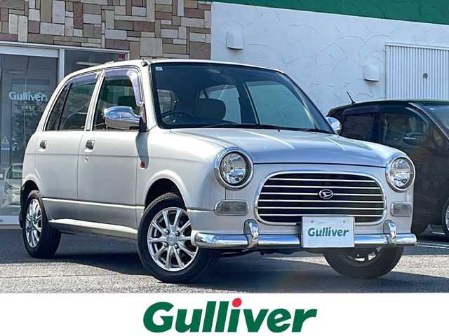 ダイハツ ミラ ジーノ 徳島県 2001(平13)年 4.4万km シルバーメタリック ドアバイザー/リヤデフォッガー/純正フロアマット/AM/FM/CD/MD/ハロゲンヘッドライト/NEXCTA 13インチアルミホイール/スペアキー/取扱説明書/新車時保証書