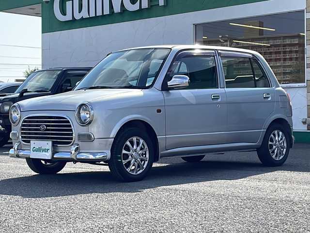 ダイハツ ミラ ジーノ 徳島県 2001(平13)年 4.4万km シルバーメタリック ドアバイザー/リヤデフォッガー/純正フロアマット/AM/FM/CD/MD/ハロゲンヘッドライト/NEXCTA 13インチアルミホイール/スペアキー/取扱説明書/新車時保証書