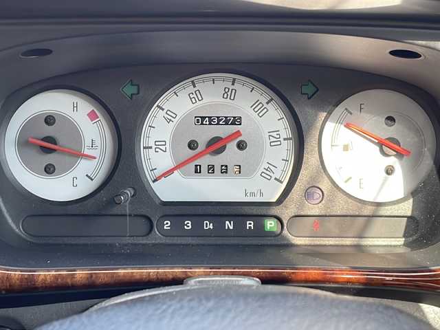 ダイハツ ミラ ジーノ 徳島県 2001(平13)年 4.4万km シルバーメタリック ドアバイザー/リヤデフォッガー/純正フロアマット/AM/FM/CD/MD/ハロゲンヘッドライト/NEXCTA 13インチアルミホイール/スペアキー/取扱説明書/新車時保証書