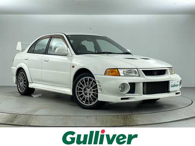 三菱 ランサー GSR エボリューションⅥ 愛知県 2000(平12)年 15万km スコーティアホワイト 4WD/ターボ/カーオーディオ【KW-MCD500】/(CD/MD/AM/FM)/OZ racing 17インチAW/personalステアリング /社外マフラー(フジツボ)/ブレンボキャリパー/レカロシート/社外LEDヘッドライト/Fフォグ/電格ミラー/オートエアコン/リモコンキー