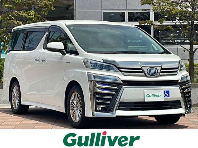 トヨタ ヴェルファイア ハイブリット ZR サイドリフトアップ 福島県 2018(平30)年 5.1万km ホワイトパールクリスタルシャイン 純正ナビゲーション/【CD/SD/USB/AUX/BT/TV】/アラウンドビューモニター/フリップダウンモニター/デジタルインナーミラー/JBLプレミアムサウンドシステム/ビルトインETC/ドライブレコーダー/前席シートヒーター/前席ベンチレーション/前席パワーシート/運転席シートメモリー/助手席オットマン/セカンド右シートオットマン/両側電動スライドドア/ブラインドスポット/純正フロアマット/ドアバイザー