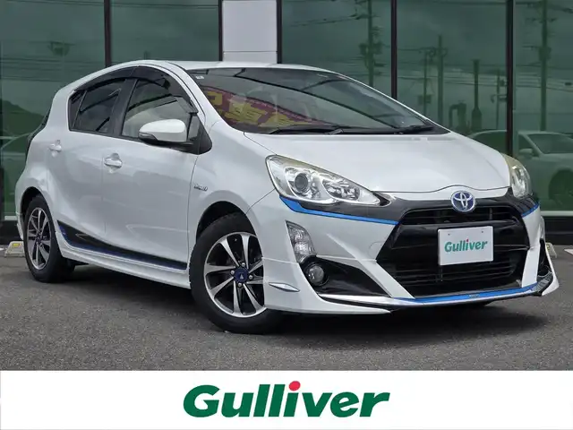 トヨタ アクア S 福岡県 2016(平28)年 18.5万km ライムホワイトパールクリスタルシャイン 純正メモリナビ（NSZT-W64）/（AM/FM/CD/BT/フルセグTV）/モデリスタエアロ（前・横・後・後下）/アイドリングストップ/プッシュスタートボタン/スマートキー/横滑り防止装置/純正フロアマット/純正LEDヘッドライト/社外１５インチアルミホイール/ETC/ドライブレコーダー