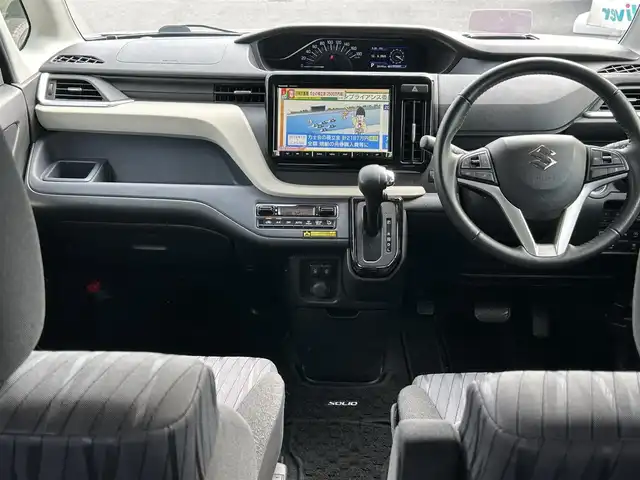 スズキ ソリオ HV MZ 長野県 2021(令3)年 3万km スターシルバーメタリック 社外ナビ（FM/AM、CD、DVD、BT、USB）/バックカメラ/フルセグテレビ/アイドリングストップ/両側パワースライドドア/前席シートヒーター/ビルトインETC/チップアップシート/レーンキープアシスト/盗難防止装置/後方コーナーセンサー/横滑り防止装置/LEDオートライト/ダブルサイドエアバック/エンジンスターター/純正１５AW/純正フロアマット/保証書、取扱説明書