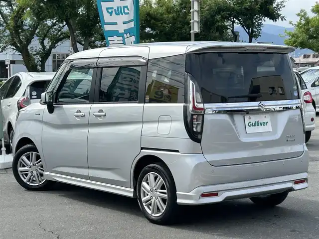 スズキ ソリオ HV MZ 長野県 2021(令3)年 3万km スターシルバーメタリック 社外ナビ（FM/AM、CD、DVD、BT、USB）/バックカメラ/フルセグテレビ/アイドリングストップ/両側パワースライドドア/前席シートヒーター/ビルトインETC/チップアップシート/レーンキープアシスト/盗難防止装置/後方コーナーセンサー/横滑り防止装置/LEDオートライト/ダブルサイドエアバック/エンジンスターター/純正１５AW/純正フロアマット/保証書、取扱説明書