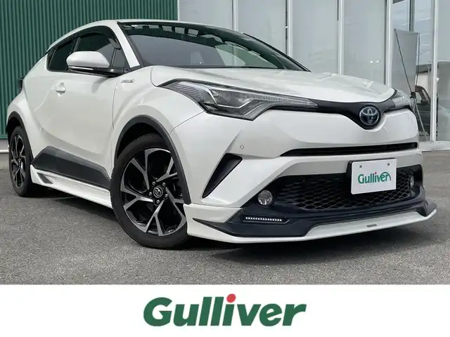 トヨタ Ｃ－ＨＲ G 福岡県 2016(平28)年 8.4万km ホワイトパールクリスタルシャイン 横滑り防止装置/Wサイドエアバッグ/カーテンエアバッグ/衝突被害軽減システム/レーンキープアシスト/盗難防止装置/純正ドラレコ/クルーズコントロール/前後車外カメラ/前後コーナーセンサー/ABS/スマートキー/BT/純正ETC/AMFM/純正フロアマット/純正アルミホイール/ハーフレザーシート/シートヒーター/エアシート/社外エアロ/オートライト