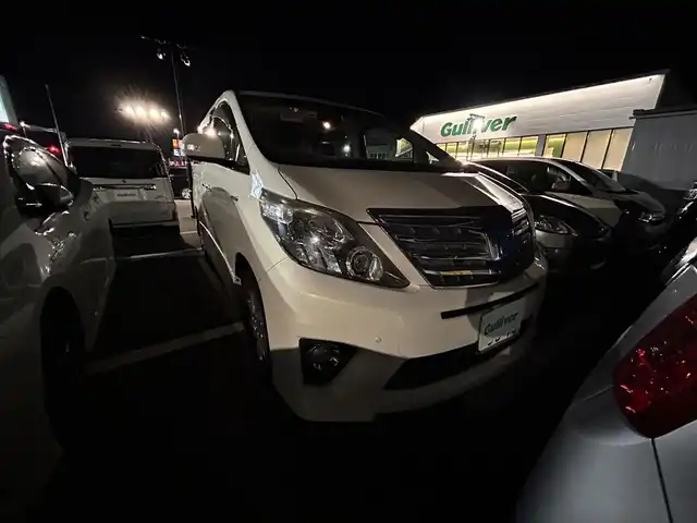 トヨタ アルファードハイブリット SR 佐賀県 2012(平24)年 6.7万km ゴールドパールクリスタルシャイン 純正8型メーカーナビゲーション/純正8型後席メーカーフリップダウンモニター/両側パワースライドドア/アラウンドビューモニター/プリクラッシュセーフティ/AFS/100V充電/レザーシートカバー/HIDヘッドライト/フォグランプ