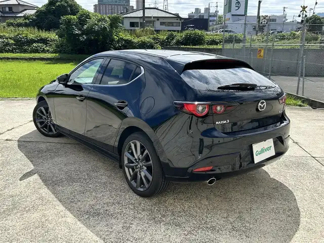 マツダ マツダ３ファストバック 15S ツーリング 長崎県 2024(令6)年 2.4万km ジェットブラックマイカ ワンオーナー/純正ディスプレイオーディオ/（Bluetooth/フルセグ）/AppleCarplay/AndroidAuto/全方位カメラ/衝突軽減システム/コーナーセンサー/レーンアシスト/ブラインドスポットモニター/レーダークルーズ/ETC/置くだけ充電/オートライト/純正18インチAW