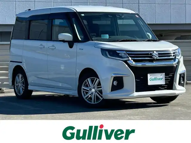 スズキ ソリオ HV MZ 静岡県 2021(令3)年 5.4万km ピュアホワイトP 純正9インチナビ/フルセグ/全周囲カメラ/両側パワースライドドア/ヘッドアップディスプレイ/スズキ セーフティ サポート/シートヒーター/コーナーセンサー/プッシュスタート/スマートキー/LEDヘッドライト/フォグライト
