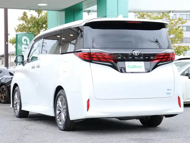 トヨタ アルファードハイブリット Z 神奈川県 2025(令7)年 0.1千km ホワイトパールクリスタルシャイン ユニバーサルステップ/左右独立ムーンルーフ/パワーサンシェード/デジタルインナーミラー/ワンオーナー/JBLスピーカー/純正メモリナビ/フルセグテレビ/バックカメラ/全周囲カメラ/ブラインドスポットモニター/ETC2.0/おくだけ充電/100V電源/革巻きコンビステアリングホイール/電動チルトテレスコピックステリング/ステアリングスイッチ/ステアリングヒーター/シートヒーター/エアーシート/225/60R18タイヤ/18インチ5本トリプルスポークスーパークロームメタリック塗装AW/快適温熱シート/マイコンプリセットドライビングポジションシステム(運転席)/助手席肩口パワーシートスイッチ/エグゼクティブパワーシート(2列目)/ウィンカーミラー/クルーズコントロール(追従走行あり)/ドアバイザー/プッシュスタート/パワーバックドア/両側パワースライドドア/純正LEDヘッドライト/純正フロアマット/コーナーセンサー前後
