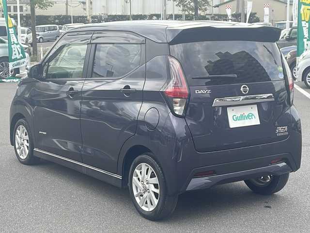 日産 デイズ ハイウェイスターX 長野県 2019(令1)年 1.4万km プレミアムパープルP 純正9型SDナビ【MM319D-L)/(TV/Bluetooth/CD/DVD/SD/iPod/AUX/USB)/全方位カメラ/純正連動ドライブレコーダー【DJ4-D】/インテリジェントLI（車線逸脱防止支援）/スマートシンプルハイブリッド/ETC2.0/前後コーナーセンサー/ステアリングスイッチ/サイドエアロパーツ/純正アルミホイール/社外フロアマット/オートライト/オートハイビーム/横滑り防止機能/ABS/盗難防止装置/サイドエアバッグ/プッシュスタート/スマートキー/スペアキー1本/パワーウインドウ/パワーステアリング/ドアバイザー/フォグランプ