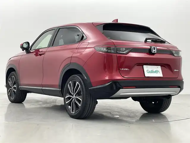 ホンダ ヴェゼル ハイブリッド e:HEV Z 熊本県 2021(令3)年 1.5万km プレミアムクリスタルレッドM 純正前後ドライブレコーダー/社外ナビ/フルセグTV/CD／DVD／SD再生/AUX/ipod/Bluetooth/USB接続/Honda SENSING/・路外逸脱抑制機能/・オートマチックハイビーム/・踏み間違え衝突軽減システム/・衝突軽減ブレーキ/・横滑り防止装置/・ブラインドスポットモニター/電動パーキングブレーキ/オートマチックブレーキホールド/電動リアゲート/前席シートヒーター/ステアリングヒーター/前後クリアランスソナー/オートライト/パドルシフト/LEDヘッドライト/フォグライト/純正18インチアルミホイール/スペアキー×１/スマートキー/プッシュスタート/ウインカーミラー/取扱説明書