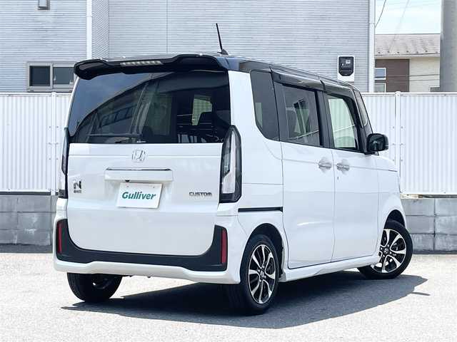 ホンダ Ｎ ＢＯＸ カスタム コーディネートスタイル 栃木県 2025(令7)年 0.4万km プラチナホワイトパール ワンオーナー/Honda SENSING/・衝突軽減ブレーキ(CMBS)/・先行車発進お知らせ機能/・歩行者事故低減ステアリング/・路外逸脱抑制機能/・標識認識機能/・渋滞追従機能付アダプティブクルーズコントロール(ACC)/・車線維持支援システム(LKAS)/・誤発進抑制機能/・後方誤発進抑制機能/・近距離衝突軽減ブレーキ/・急アクセル抑制機能/・パーキングセンサーシステム/・オートハイビーム/純正8インチメモリナビ【VXM-245ZFEi】/・地デジ/・Bluetooth/・USB/純正14インチアルミホイール/リアワイドカメラ/両側パワースライドドア/運転席＆助手席シートヒーター/ETC/電子制御パーキングブレーキ/オートブレーキホールド機能/フルLEDヘッドライト/LEDフォグランプ/取扱説明書/保証書/スペアキー１