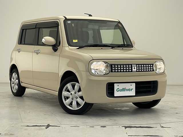 スズキ ラパン 10thアニバーサリーリミテッド 沖縄県 2012(平24)年 8.8万km ミルクティーベージュメタリック 社外ナビ(ＡＶＩＣ－ＺＨ０７)/(フルセグＴＶ　Ｂｌｕｅｔｏｏｔｈ　ＣＤ　ＤＶＤ　ＡＭ　ＦＭ)　/ビルトインＥＴＣ　/スマートキー　/プッシュスタート　/シートヒーター　/オートエアコン　/電動格納ミラー　/純正フロアマット　/ベンチシート