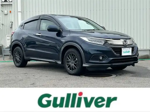 ホンダ ヴェゼル ハイブリッド X ホンダセンシング 富山県 2020(令2)年 6.5万km ミッドナイトブルービームM ４WD/フルセグTV/純正ナビ/Bluetooth/ドライブレコーダー/DVD再生/バックカメラ/ビルトインETC/レーダークルーズコントロール/レーンキープアシスト/横滑り防止装置/衝突軽減装置/社外アルミホイール/純正AWサマータイヤ4本車載/ドアバイザー/オートライト/フォグランプ