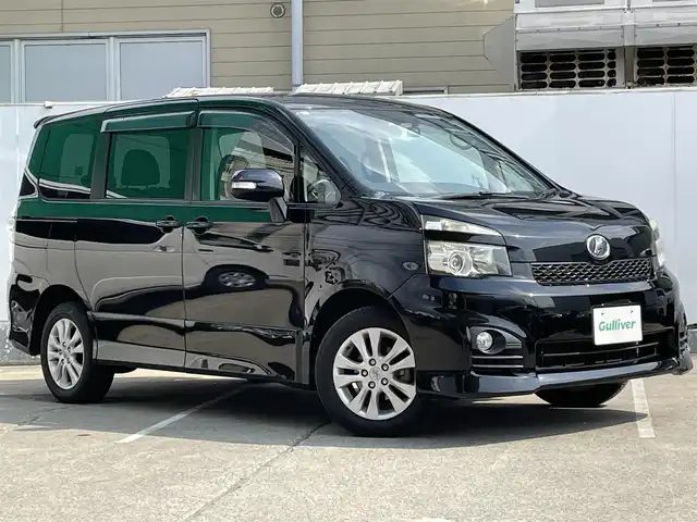 トヨタ ヴォクシー ZS 青森県 2010(平22)年 10.8万km ブラック AIS評価3.5点/4WD/ワンオーナー/純正メモリナビ/[BT/AM/FM/DVD/CD/AUX]/フルセグテレビ/バックカメラ/WAC/寒冷地仕様/両側パワースライドドア/純正AW(16インチ)/純正フロアマット/社外ドライブレコーダー/保証書/取扱説明書