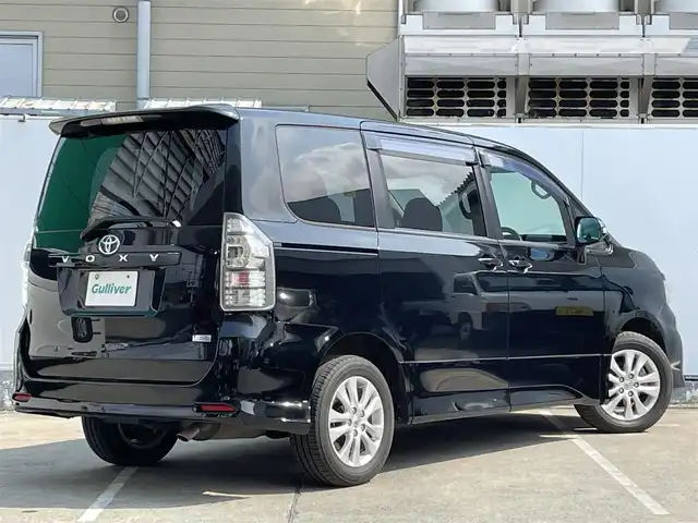 トヨタ ヴォクシー ZS 青森県 2010(平22)年 10.8万km ブラック AIS評価3.5点/4WD/ワンオーナー/純正メモリナビ/[BT/AM/FM/DVD/CD/AUX]/フルセグテレビ/バックカメラ/WAC/寒冷地仕様/両側パワースライドドア/純正AW(16インチ)/純正フロアマット/社外ドライブレコーダー/保証書/取扱説明書